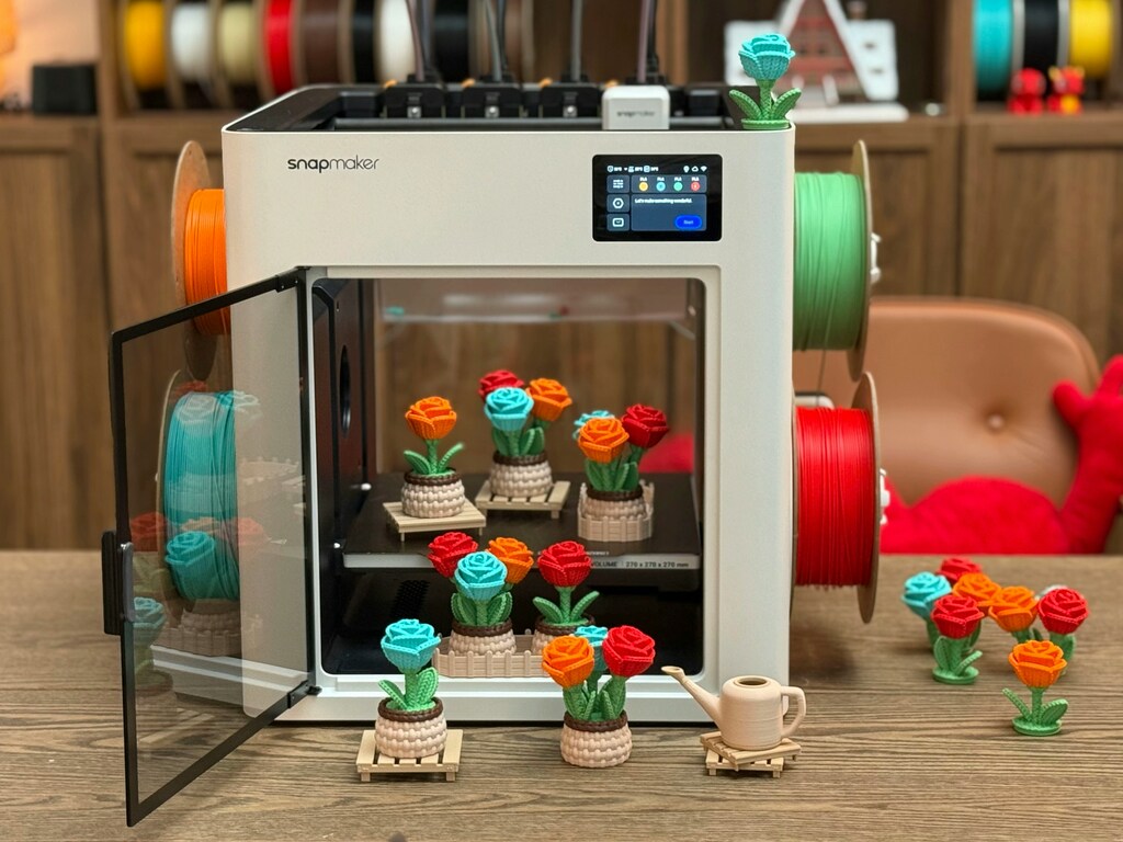 obinas de filamento PLA junto a una calculadora mostrando cuánto cuesta empezar en impresión 3d